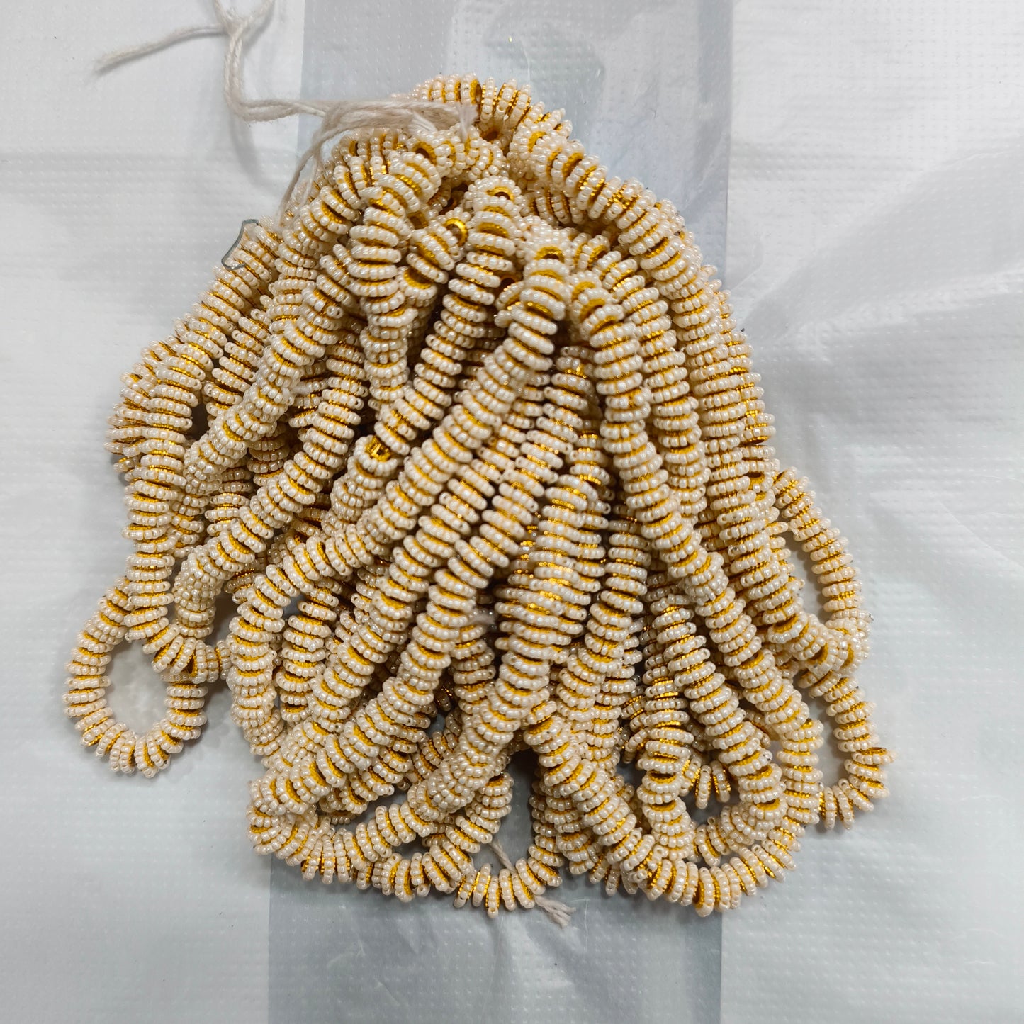 Seed beads rakhi ring string of 100pc